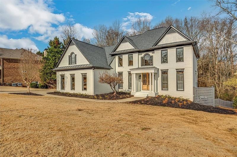 View of front of house with a front yard
