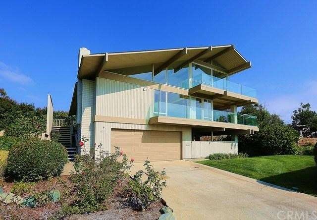 Exterior of the home with wall to wall windows