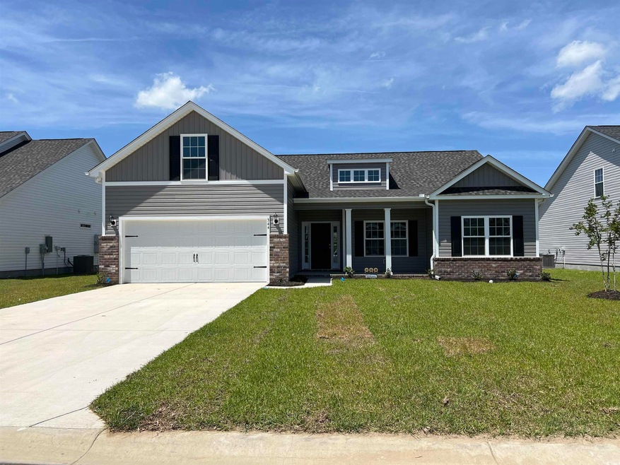 Craftsman house with a front yard, cooling unit, r