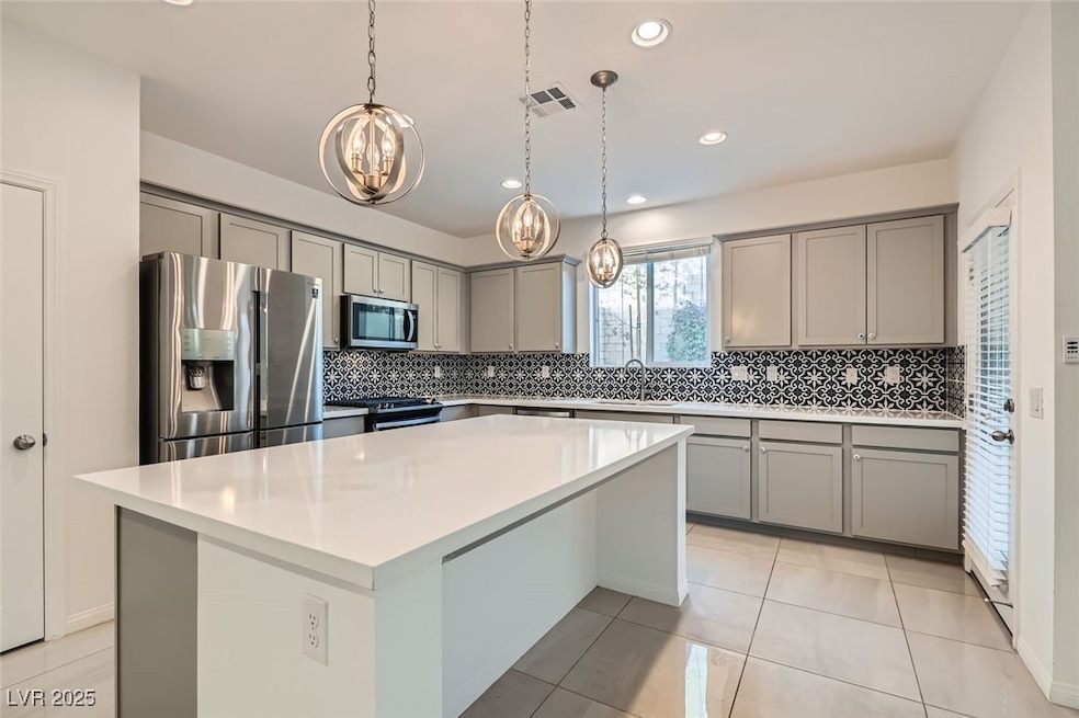 Kitchen featuring appliances with stainless steel