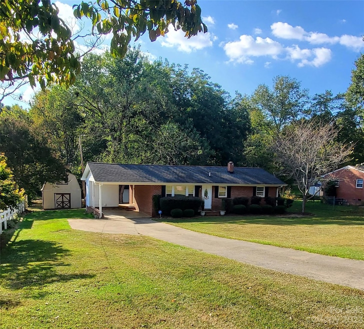 Front of home nestled about 75ft. from street