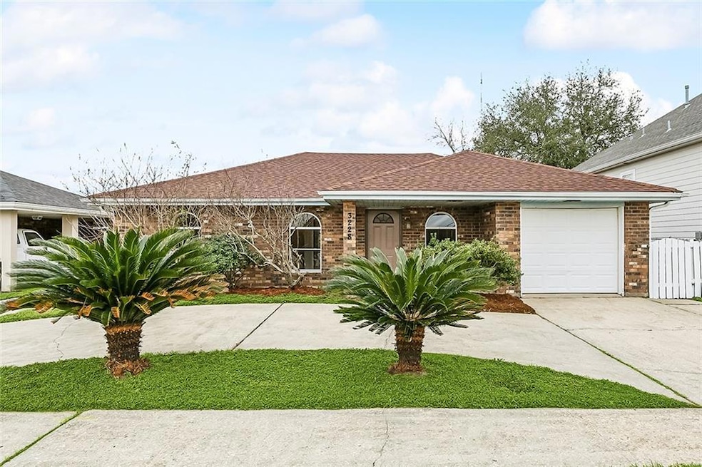 Neat, clean ranch with a half-moon driveway, extra