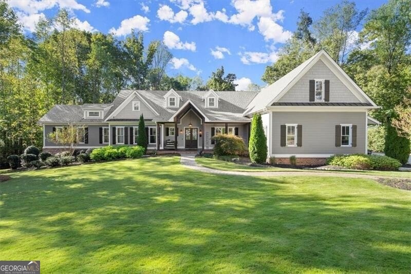 Craftsman-style home with a front yard