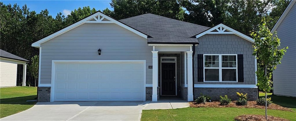 Craftsman inspired home with a garage and a front 