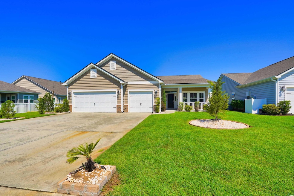 Ranch-style house with a garage and a front yard