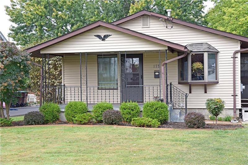 Charming ranch with nice front porch and large fen