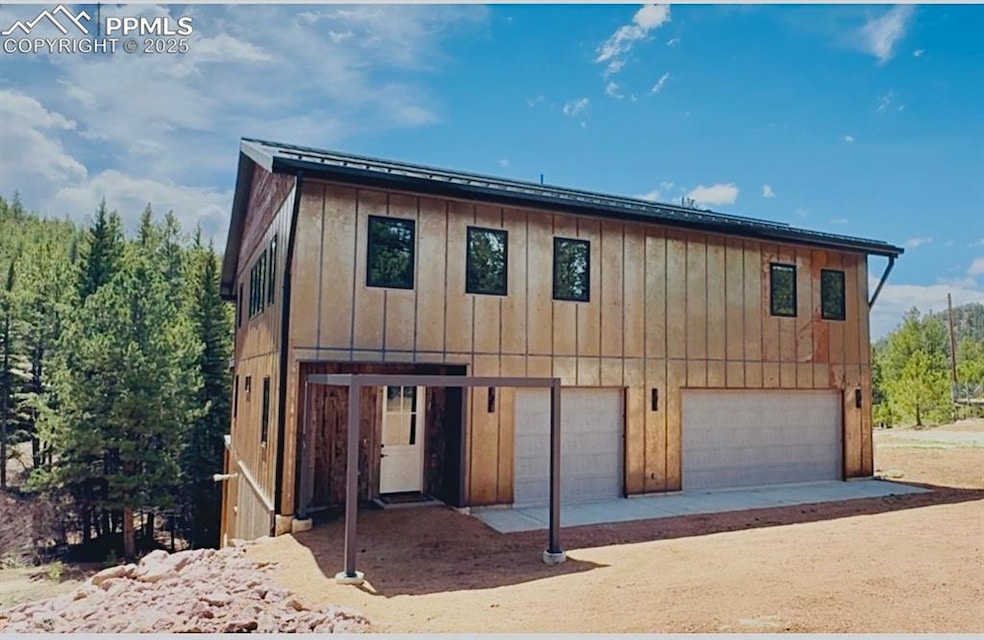 View of front of property featuring driveway, an a