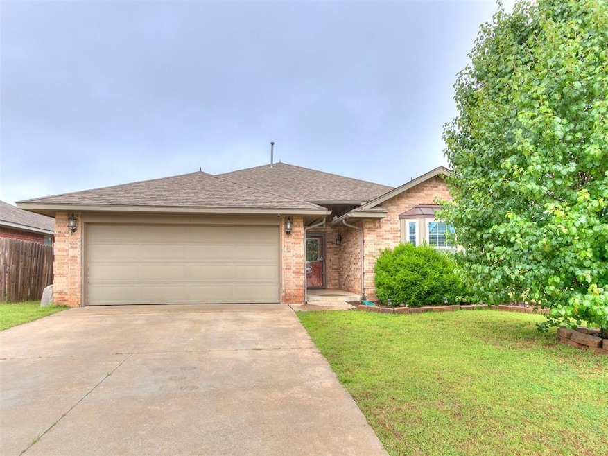 Ranch-style home featuring concrete driveway, brick siding, a garage, and roof with shingles