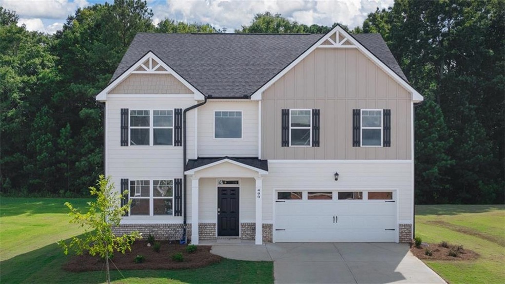 Craftsman-style home featuring a garage and a fron