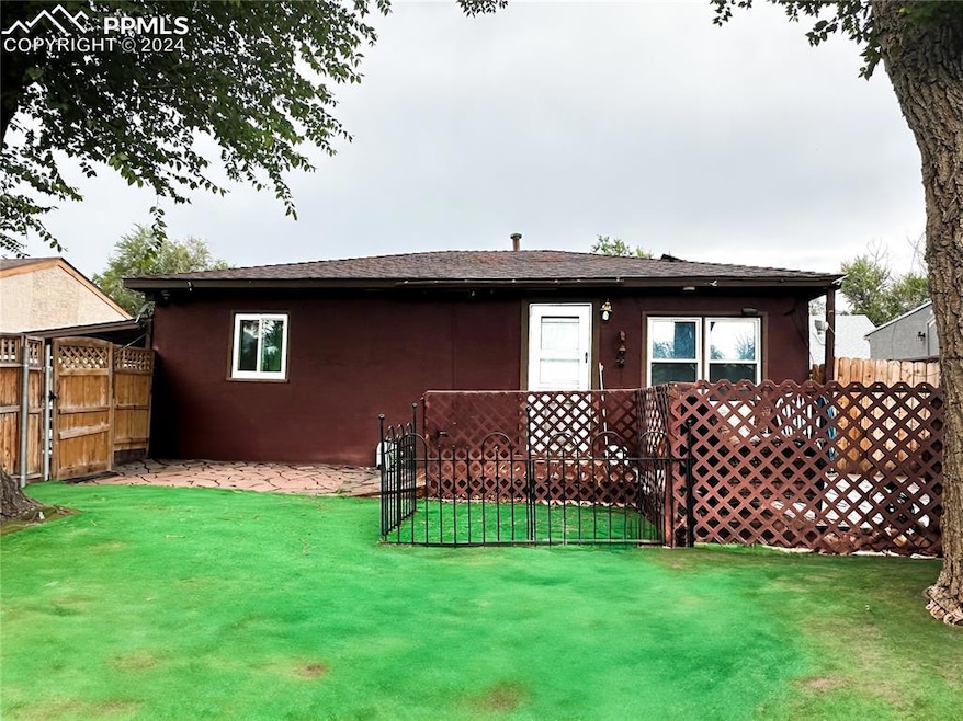 Front view of property with a xeriscape lawn with 
