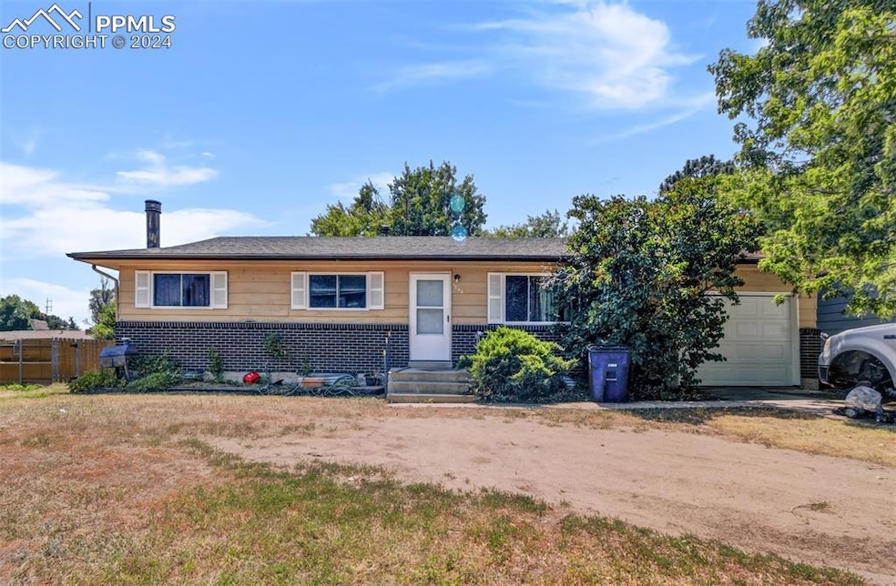 Single story home featuring a garage