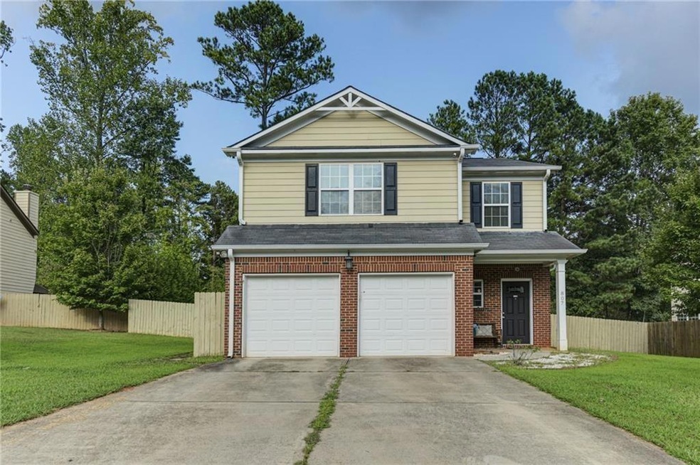 View of front of property with a garage and a fron
