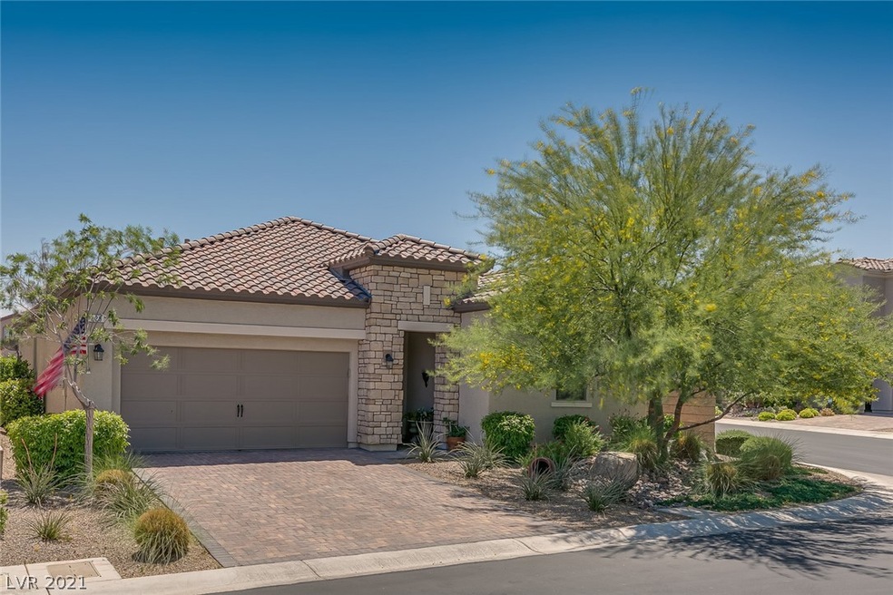 Front View With Tree For Shade And Stone Facade.