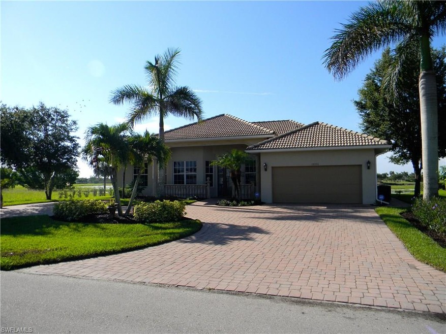 Front Of House Feat. Circular Brick-Paver Driveway