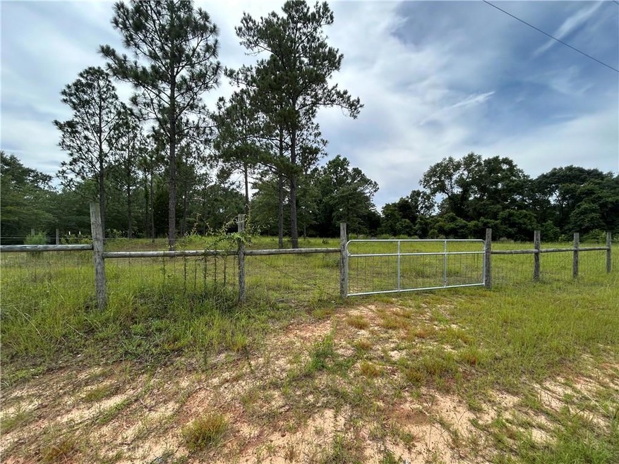 View of yard featuring a gate and a view of rural / pastoral area