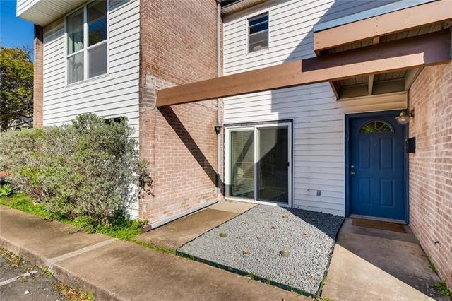 Fresh landscaping and bright blue door welcome you