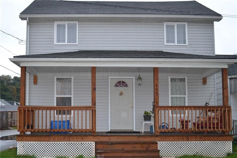 Newer windows, siding, front door, and porch.