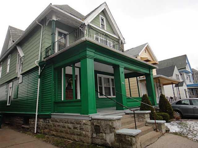 Exterior Front. Two units in main house and a thir