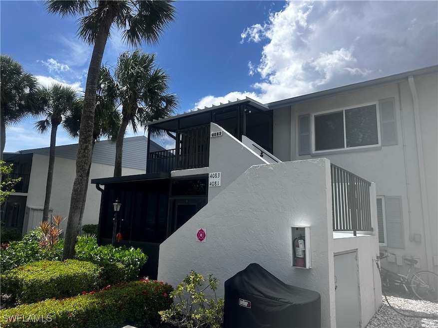 View of side of property with stucco siding and a balcony