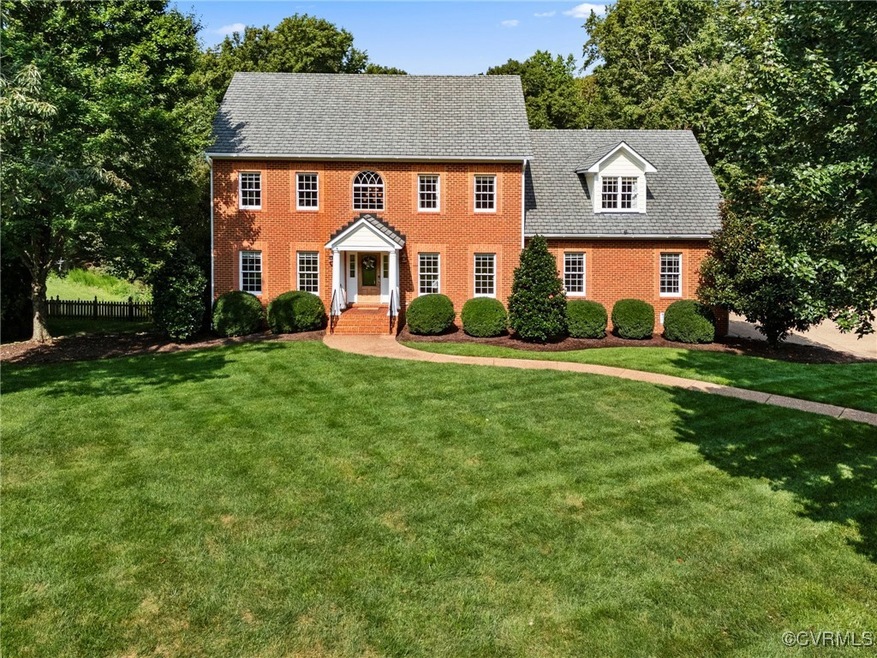 Colonial inspired home featuring a meticulously ma