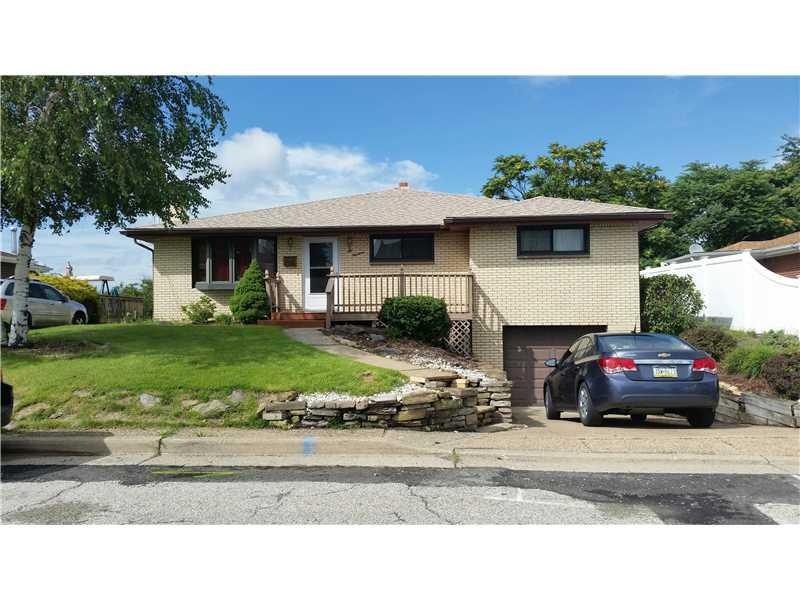 Exterior Front. Warm & Inviting Brick Ranch with B