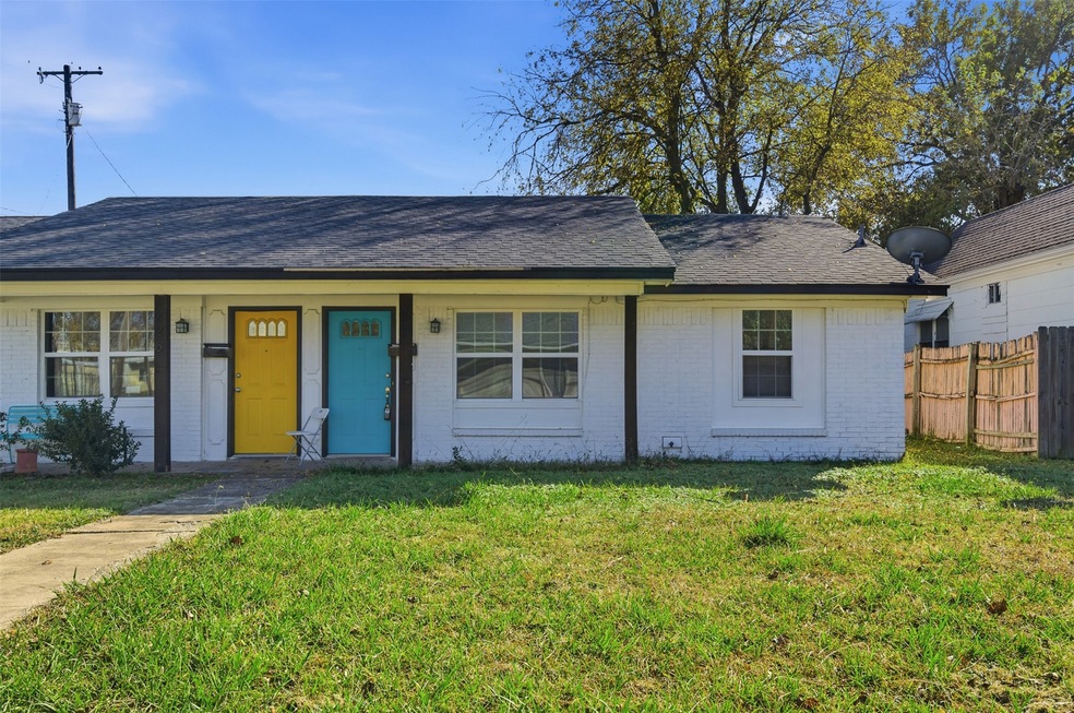 Ranch-style house featuring brick siding, roof with shingles, and covered porch