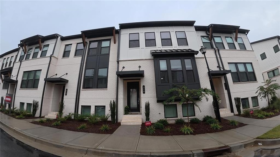 Contemporary house featuring brick siding
