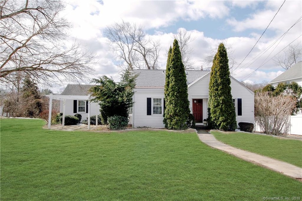 Front view featuring patio with pergola.