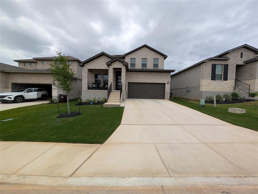 View of front of home with an attached garage, dr
