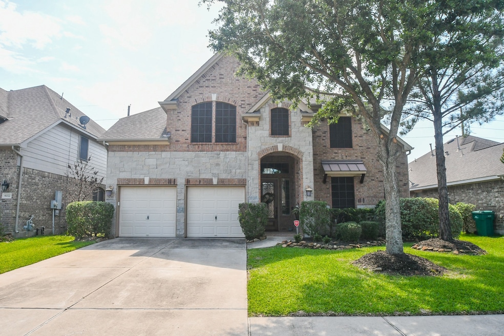 This gorgeous brick and stone residence ---  a rep