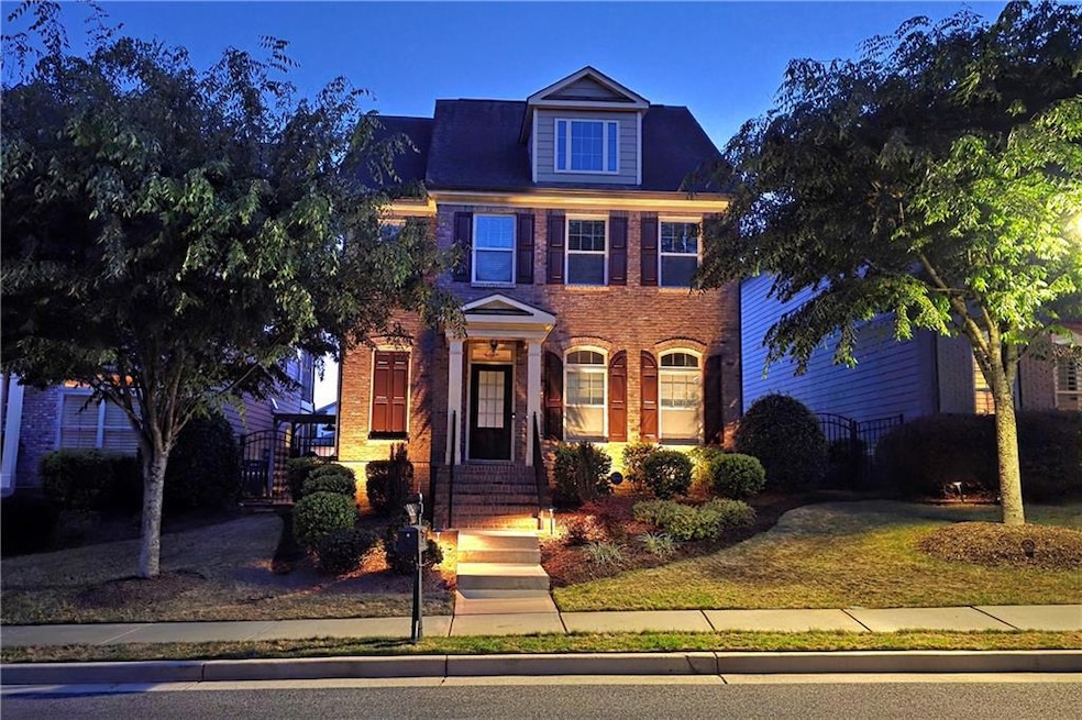Front elevation, classic traditional features with brick facia and wall-washer lighting creates a majestic view.