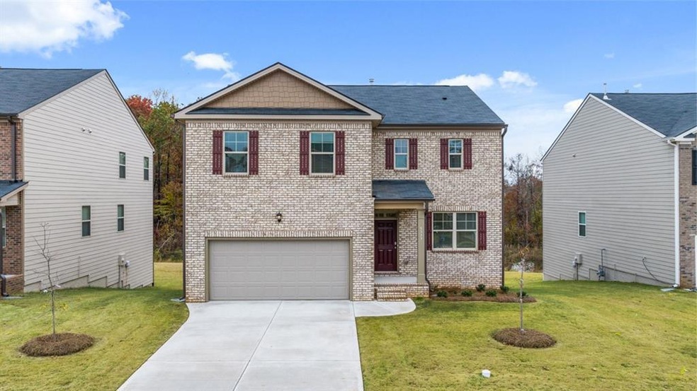 View of front of home featuring a front lawn and a