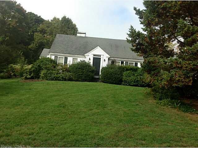 Exterior Front. Located on a corner lot, this Cape