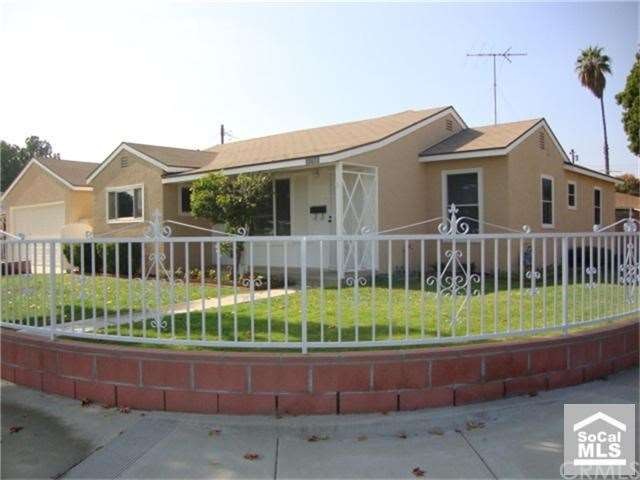 White wrought iron fence