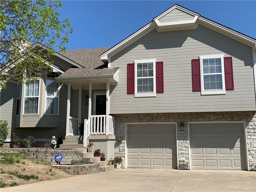 409 N Franklin St, Raymore, MO 64083 - photo 1