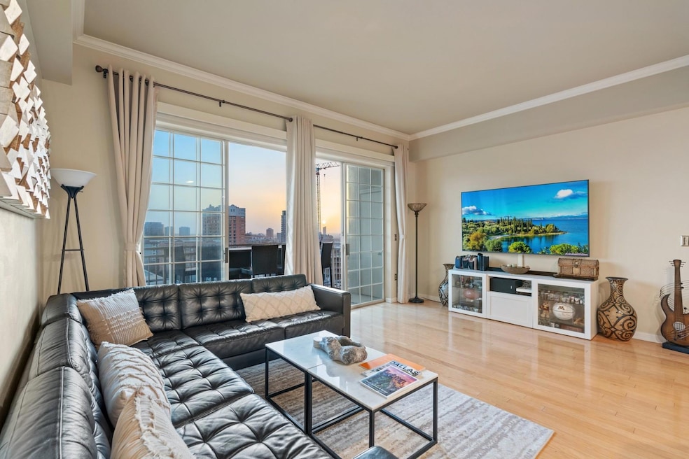 Living area with baseboards, ornamental molding, a
