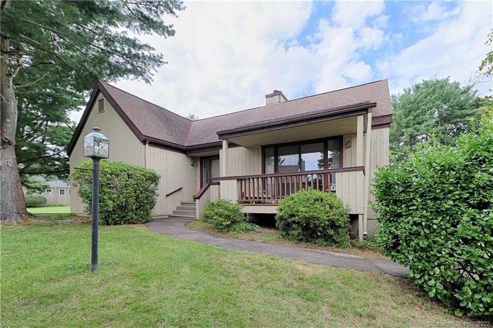 Front view of condo with covered porch.