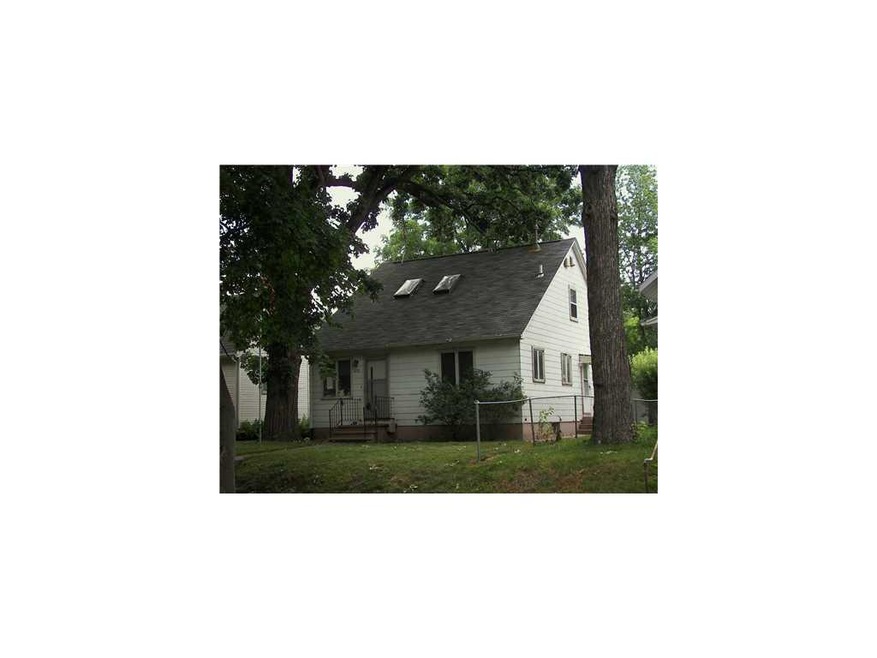 Front Exterior. Mature trees in front w/ sky light