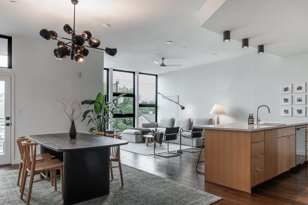 Dining area with expansive windows, dark wood-sty