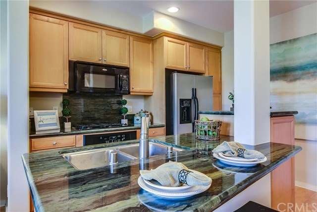 Gorgeous granite highlights this open kitchen