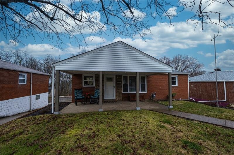 Brick exterior with new concrete walk and patio.
