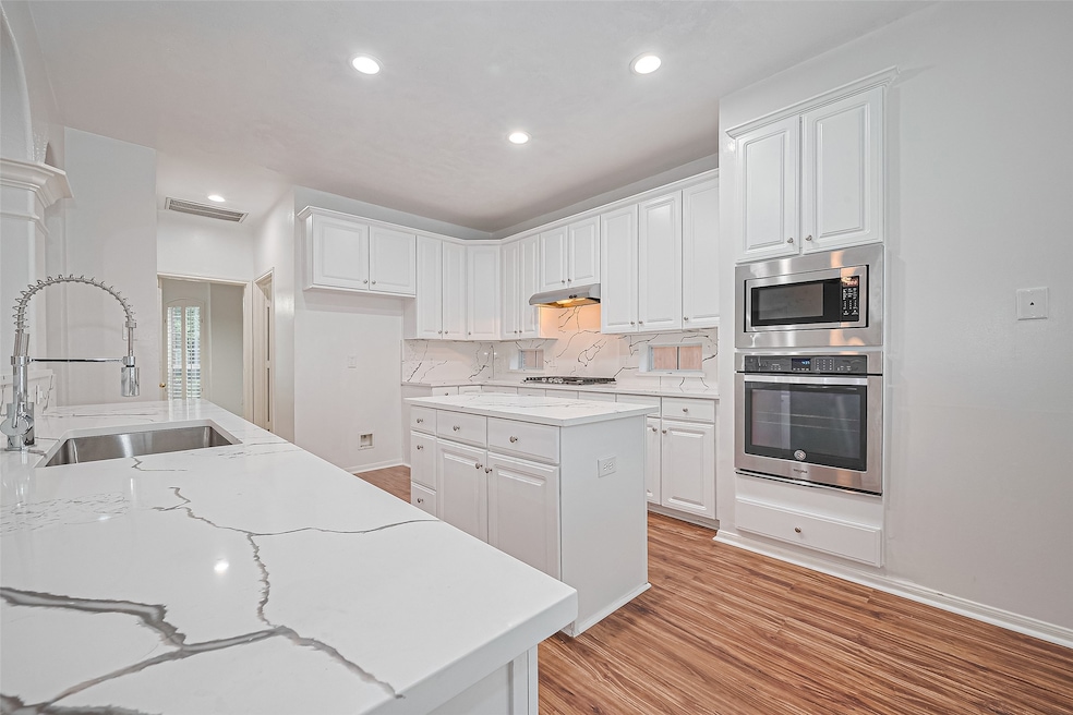 This chef’s dream kitchen boasts sleek quartz coun