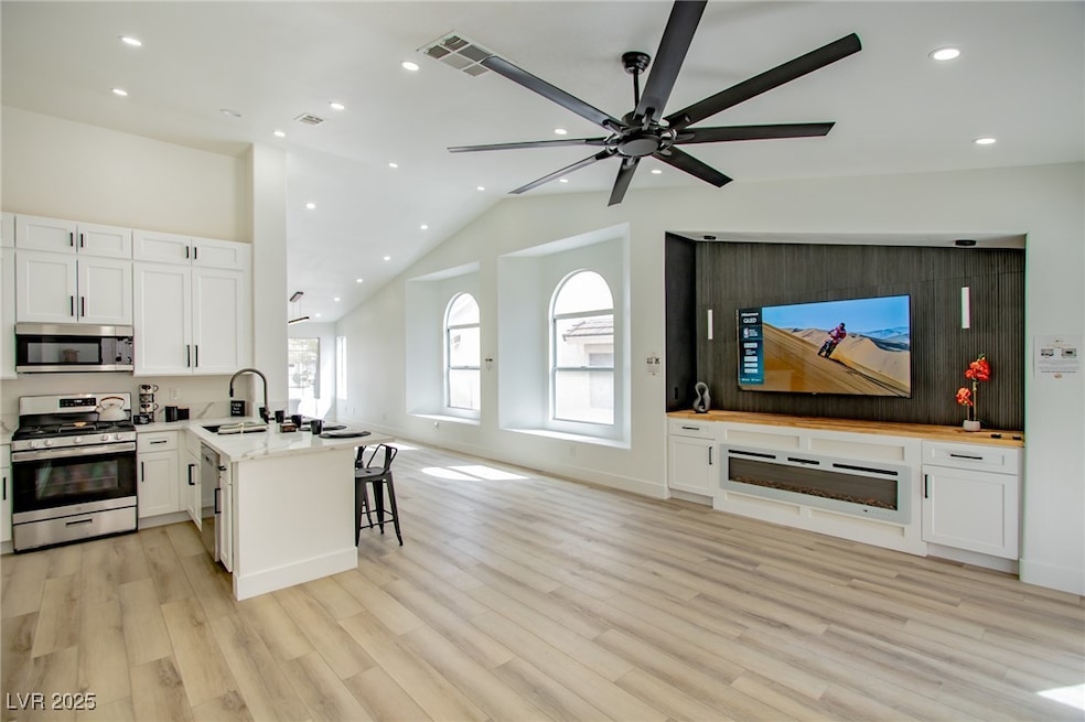 Kitchen featuring open floor plan, a peninsula, wh