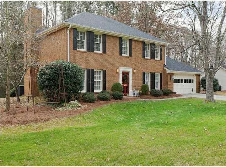 Exterior Front. Charming 4-sided brick home on lar