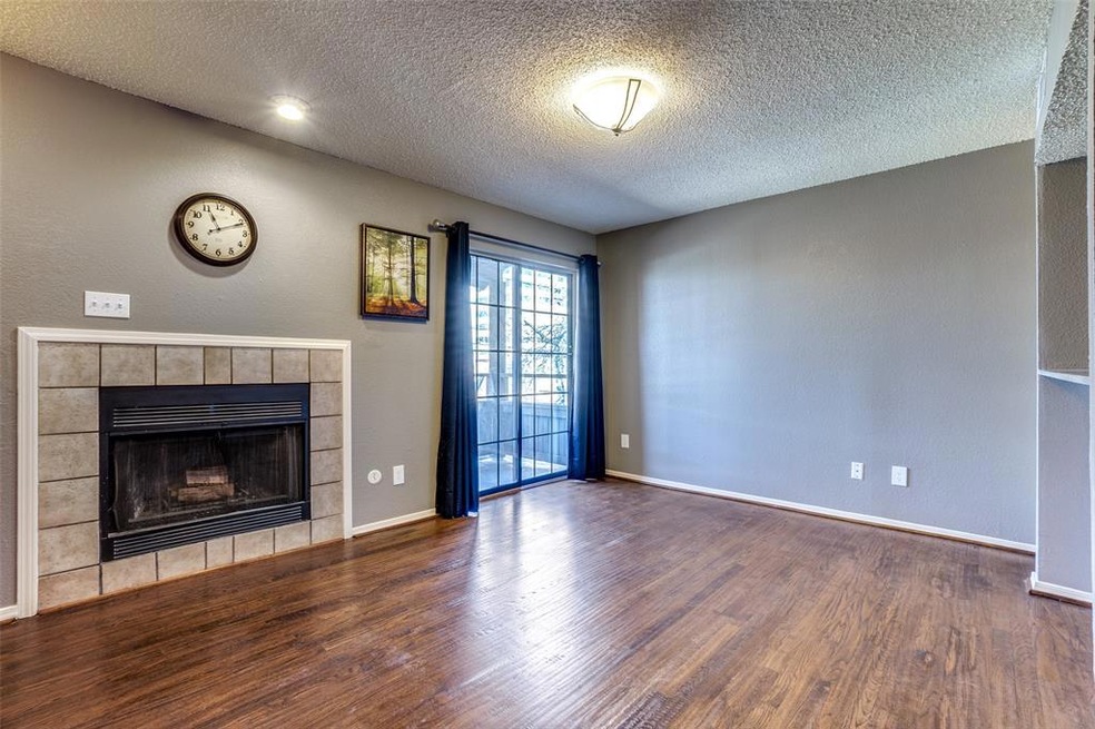 Wood burning fireplace in living room and access t