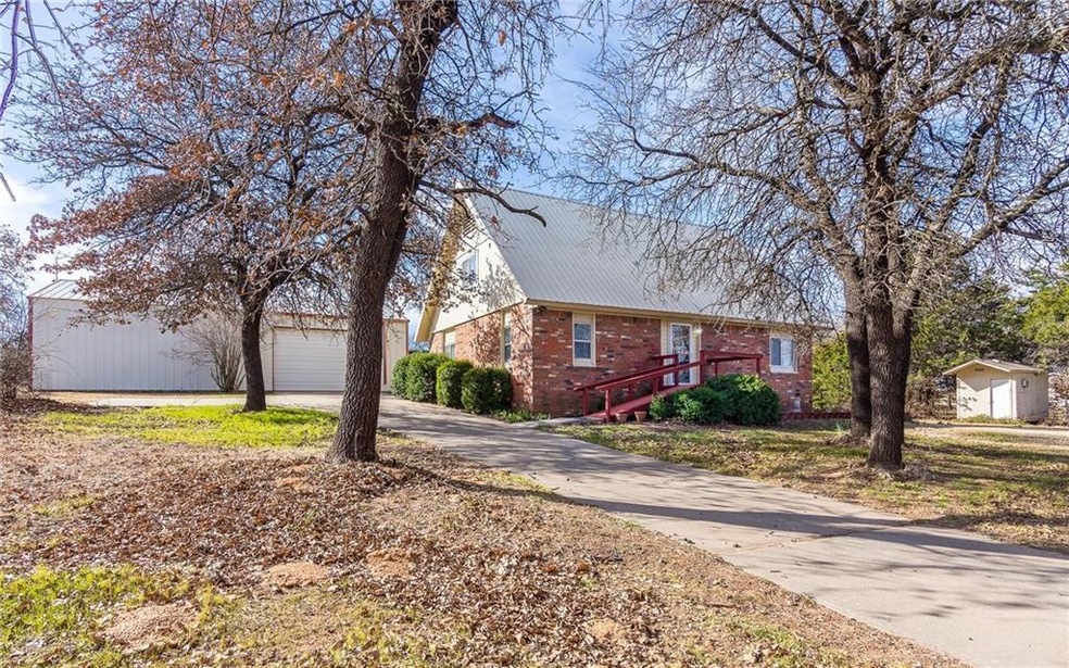 Front of home.  30x50 shop and extra storage building that used to be set up as an office.
