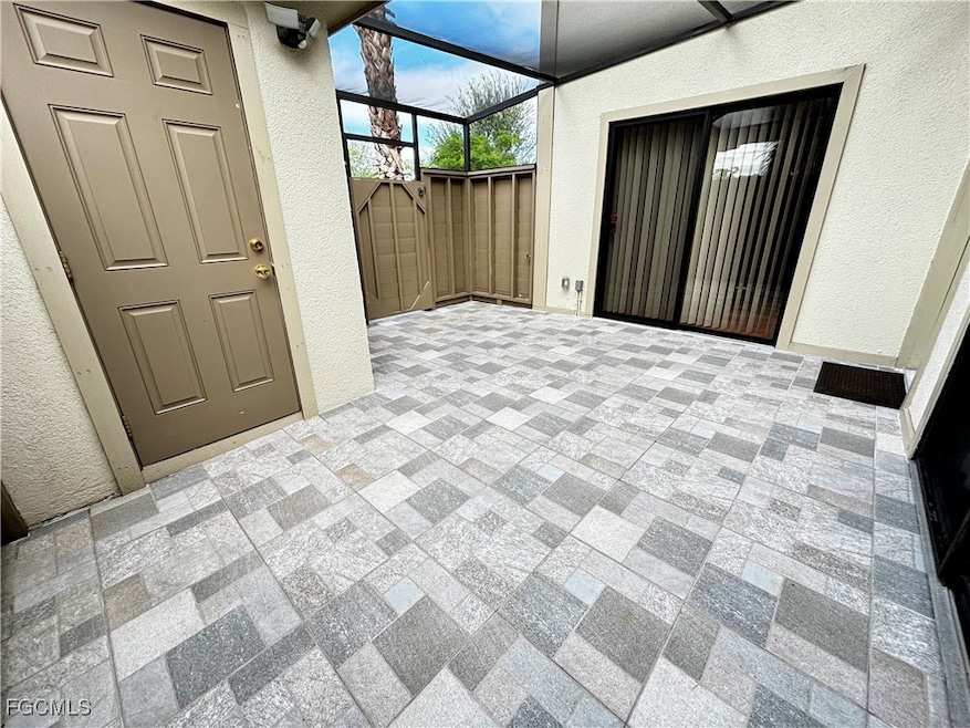 View of patio / terrace featuring a sunroom and a lanai