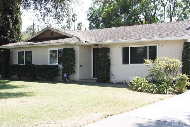 Nicely maintained home on a tree lined street.