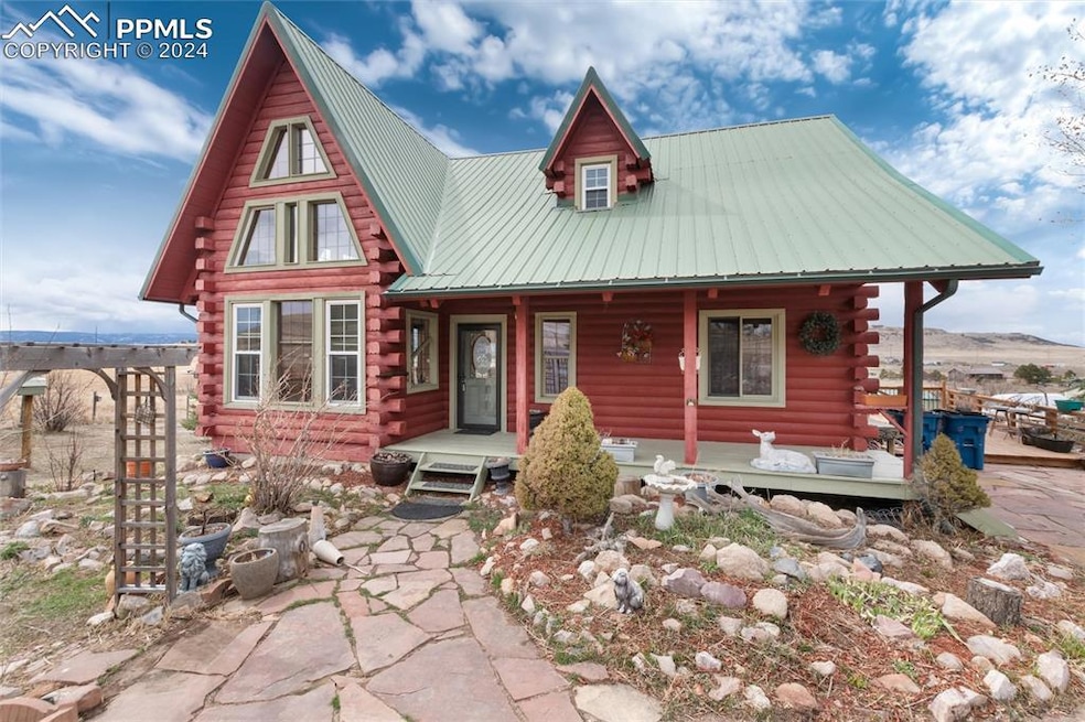 Log-style house with covered porch
