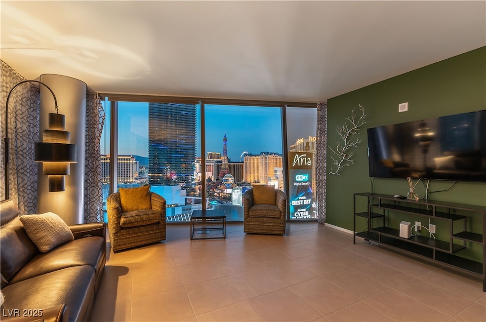 Living area featuring expansive windows, tile patt